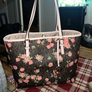 Michael Kors Purse with monogram and roses.